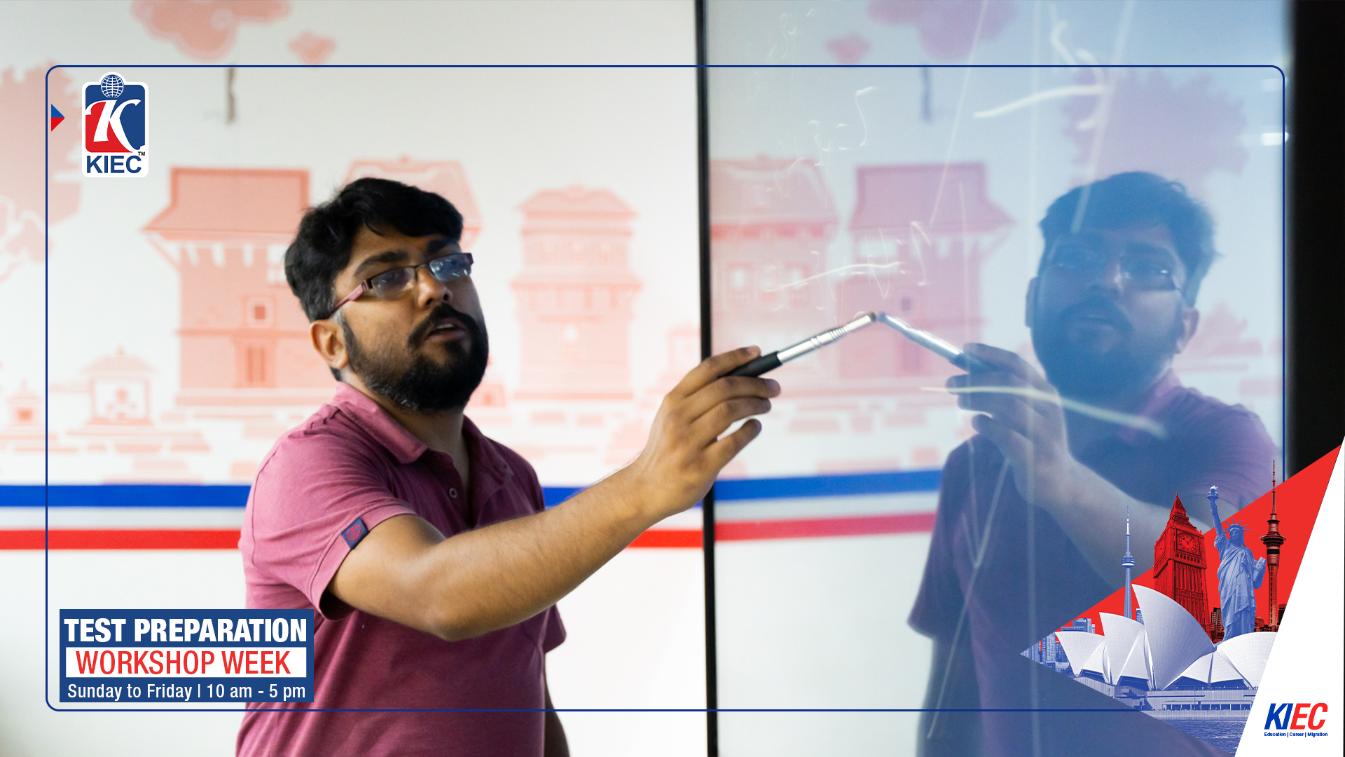 Anup Aryal working through mathematics on a classroom display at KIEC